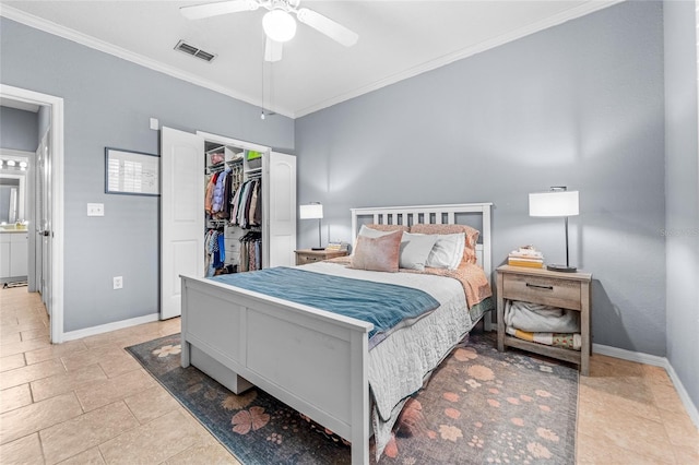 bedroom with crown molding, a spacious closet, ceiling fan, and a closet