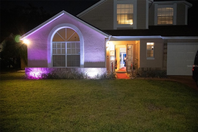 view of front of house with a lawn