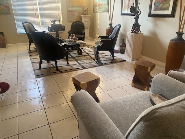 living room with tile patterned floors and baseboards