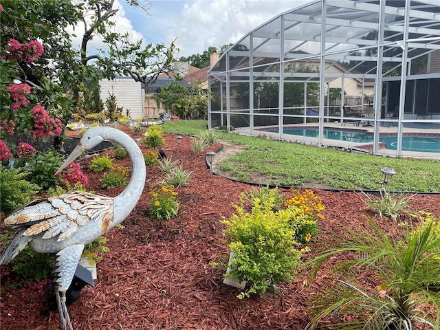 view of yard featuring a lanai and an outdoor pool