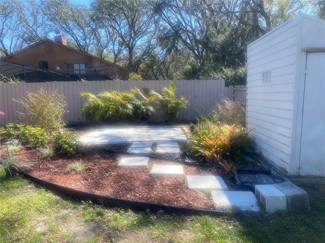 view of yard featuring a patio and fence