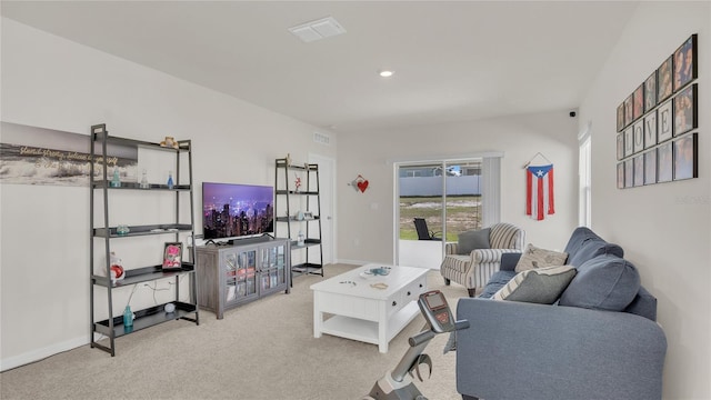 living room featuring light carpet