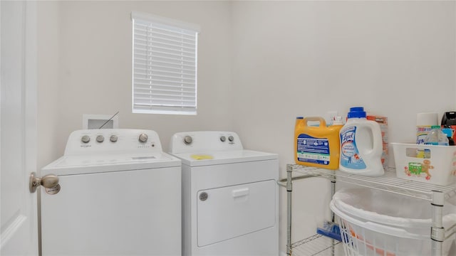 laundry room with washing machine and dryer