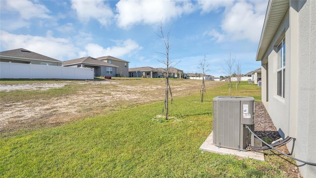 view of yard with central AC