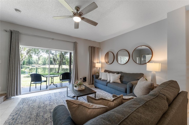 tiled living room with ceiling fan and a textured ceiling