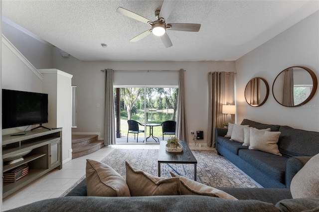 tiled living room with ceiling fan and a textured ceiling