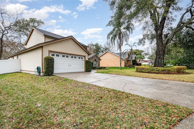 view of property exterior featuring a yard, stucco siding, concrete driveway, fence, and a garage