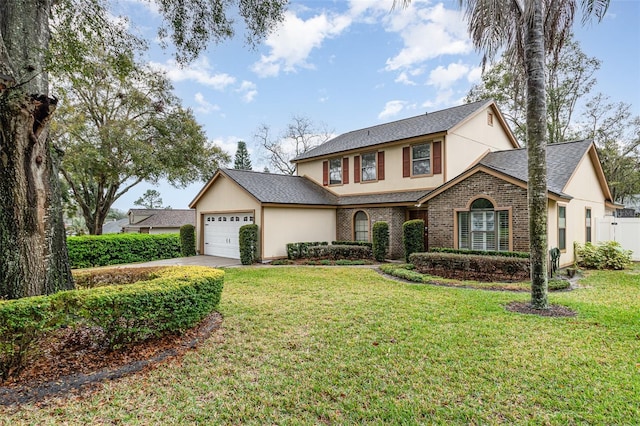 traditional home featuring brick siding, roof with shingles, concrete driveway, an attached garage, and a front yard