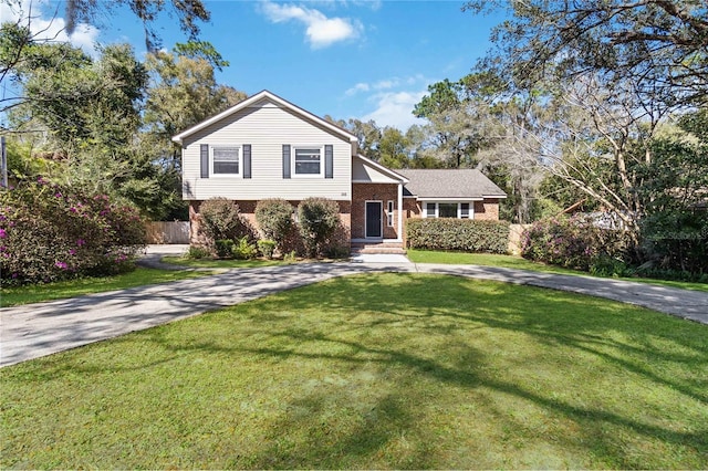 split level home with a front yard