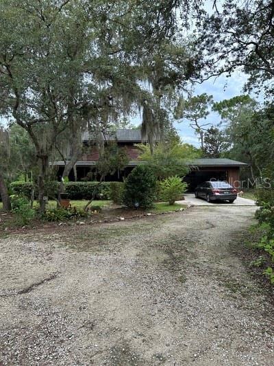 view of front facade featuring a carport