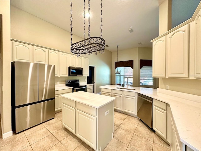 kitchen featuring a kitchen island, appliances with stainless steel finishes, pendant lighting, sink, and kitchen peninsula