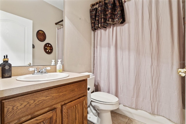 full bathroom with shower / bath combination with curtain, vanity, toilet, and tile patterned flooring