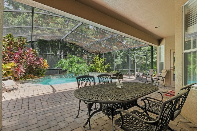 view of patio / terrace with glass enclosure