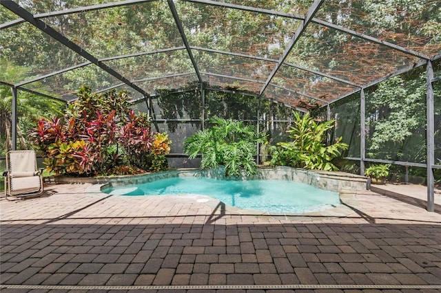 view of pool with a lanai and a patio area