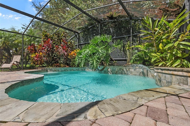 view of pool featuring a lanai and a patio area