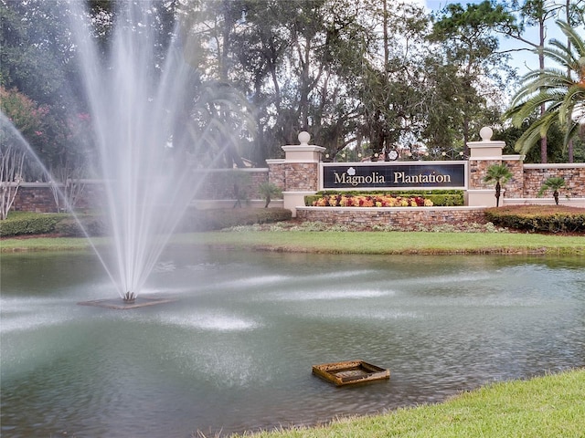 community sign with a water view