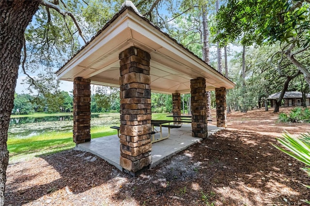 view of community with a gazebo and a water view