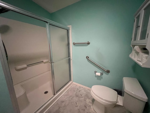 bathroom with walk in shower and toilet