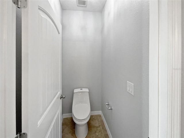 bathroom featuring toilet