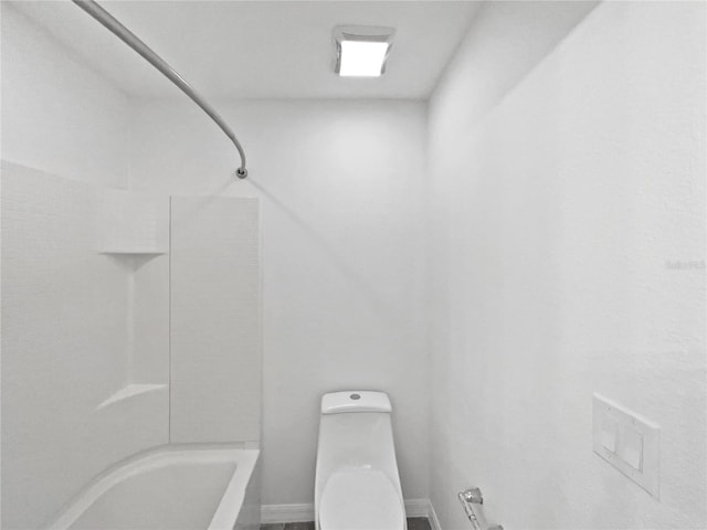 bathroom featuring  shower combination and toilet