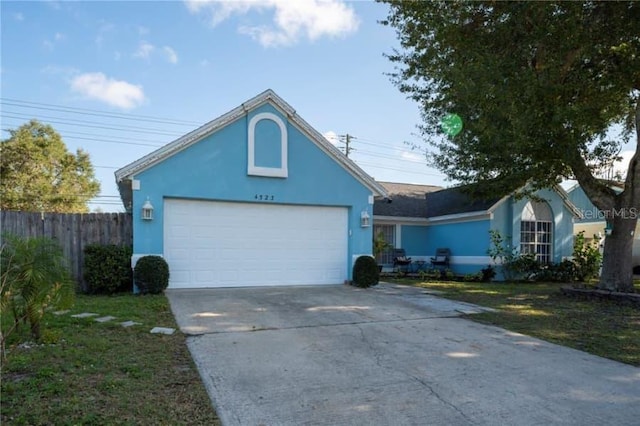 ranch-style house featuring a garage