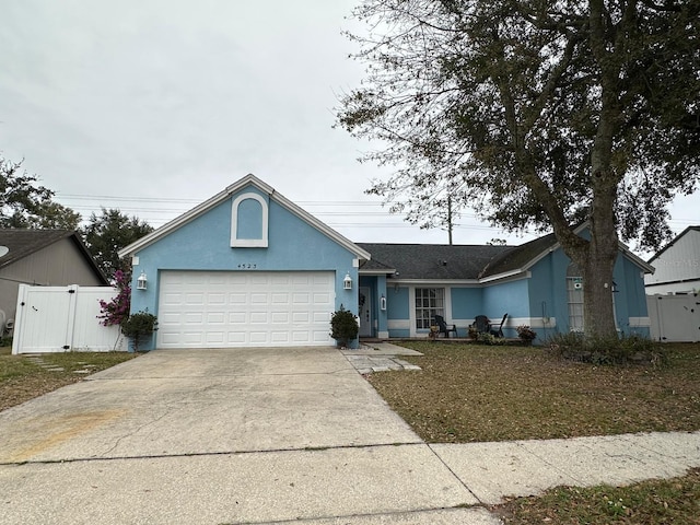 single story home featuring a garage