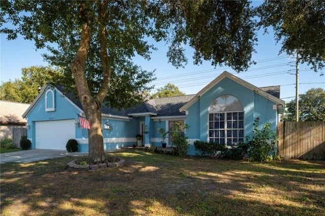 ranch-style house with a garage and a front yard