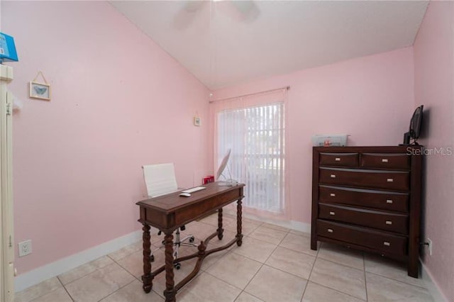 tiled home office with ceiling fan and vaulted ceiling