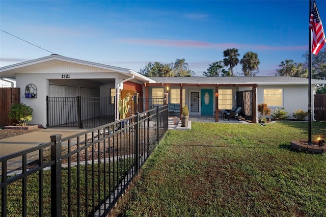 ranch-style home featuring a lawn