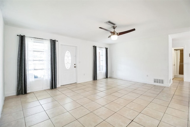 unfurnished room featuring light tile patterned floors and ceiling fan