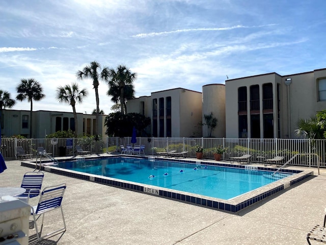 view of swimming pool featuring a patio