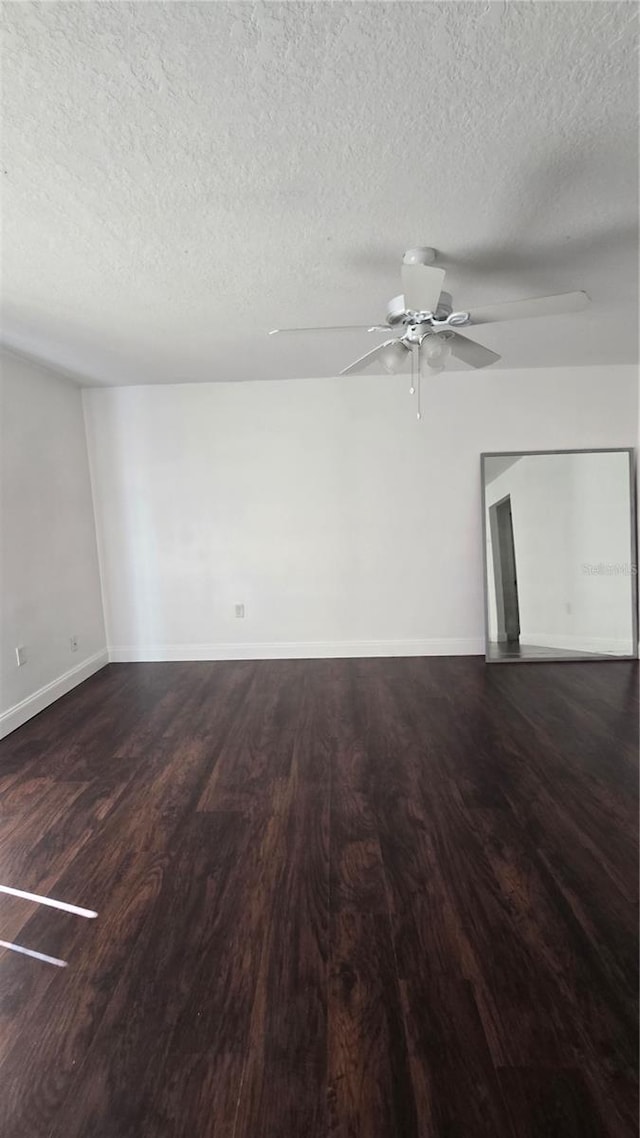516 Orange Dr Unit 17, Altamonte Springs, FL 32701 - spare room with a textured ceiling, wood finished floors, a ceiling fan, and baseboards