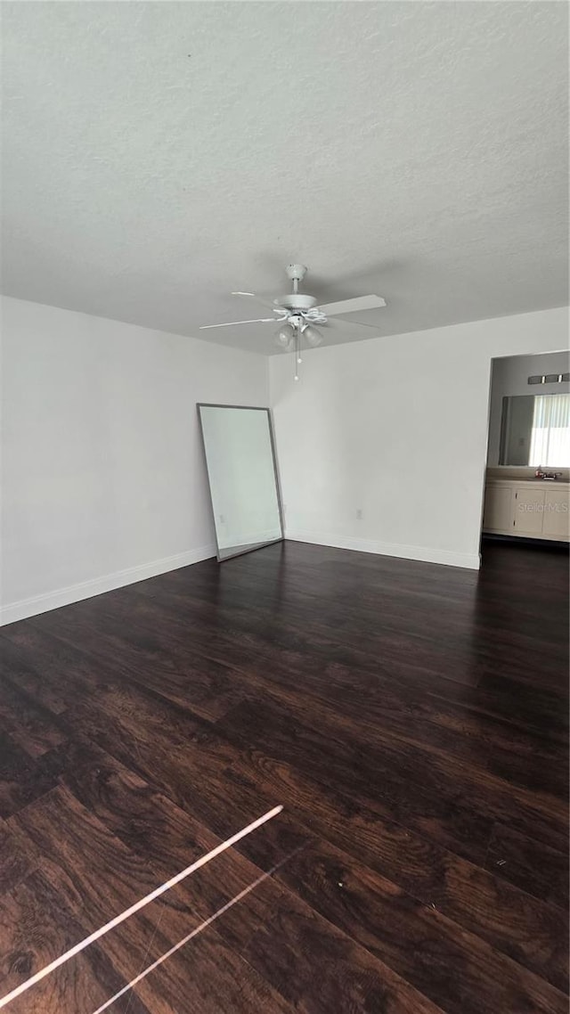516 Orange Dr Unit 17, Altamonte Springs, FL 32701 - unfurnished room featuring a ceiling fan, a textured ceiling, baseboards, and wood finished floors