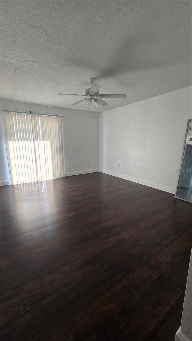 516 Orange Dr Unit 17, Altamonte Springs, FL 32701 - empty room featuring ceiling fan, a textured ceiling, dark wood finished floors, and baseboards