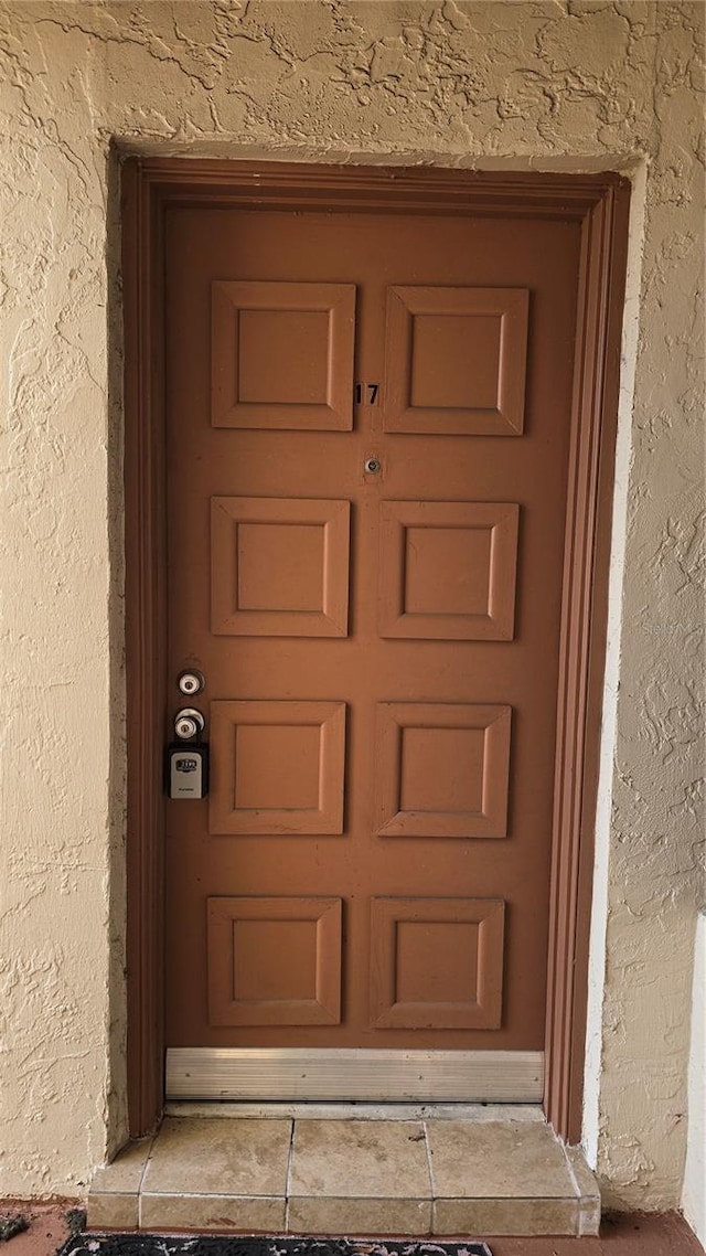 516 Orange Dr Unit 17, Altamonte Springs, FL 32701 - entrance to property featuring a garage and stucco siding