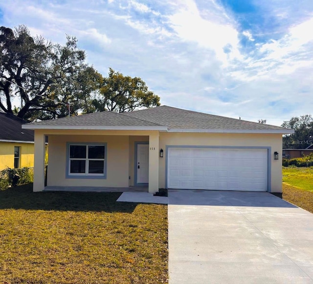 ranch-style home featuring a garage and a front yard