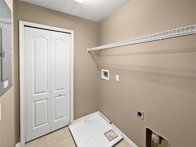 laundry room with hookup for an electric dryer, hookup for a washing machine, and light tile patterned floors