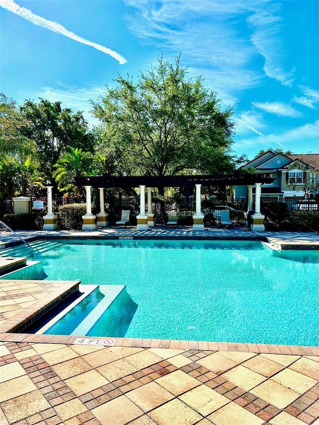 6912 Hochad Dr, Orlando, FL 32819 - community pool with a pergola and a patio area
