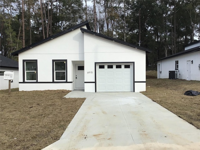 6915 SE 23rd Ave, Ocala, FL 34480 - view of front of property featuring central AC and a front lawn