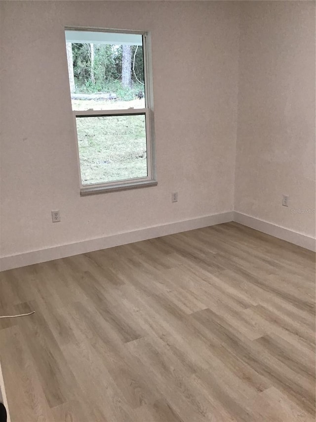 6915 SE 23rd Ave, Ocala, FL 34480 - empty room featuring light wood-type flooring