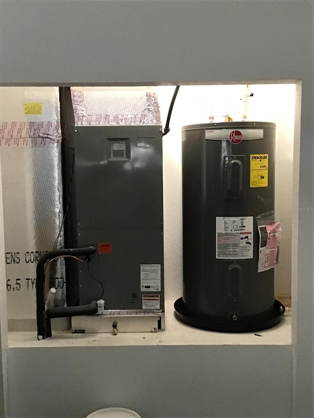 6915 SE 23rd Ave, Ocala, FL 34480 - utility room featuring heating unit and water heater