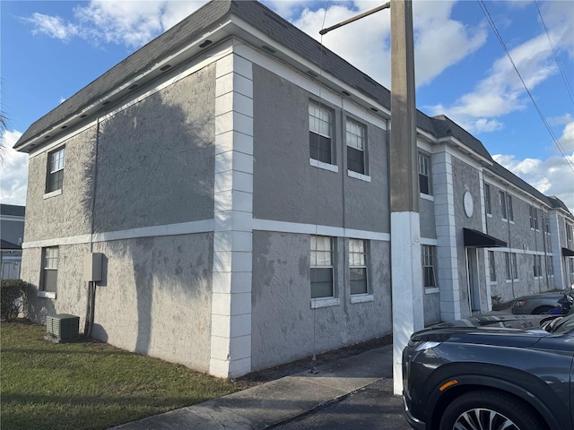 view of home's exterior featuring central AC unit