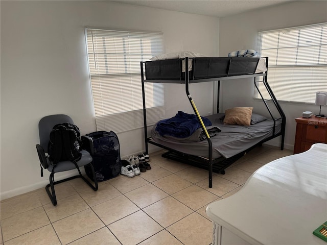 bedroom featuring light tile patterned floors