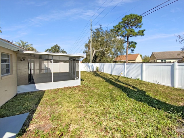 view of yard with a sunroom