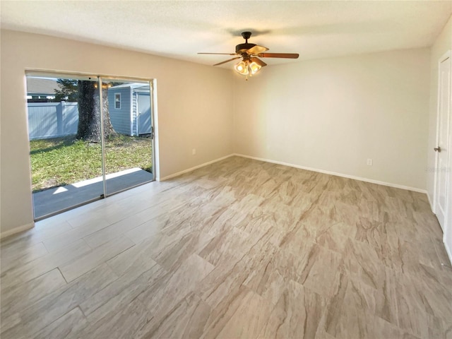 empty room featuring ceiling fan and a textured ceiling