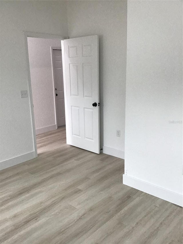 unfurnished room featuring light hardwood / wood-style flooring