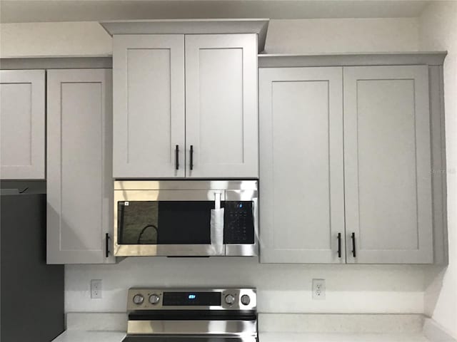 interior details featuring appliances with stainless steel finishes