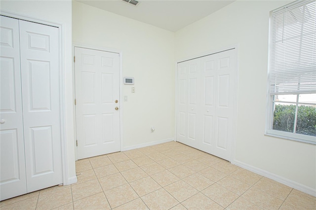 entrance foyer with light tile patterned floors