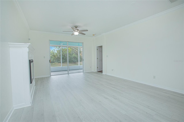 unfurnished living room with crown molding, ceiling fan, and light wood-type flooring