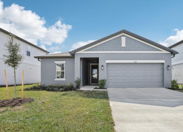 ranch-style home with a garage and a front yard